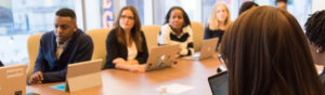 picture of business people sitting around conference table